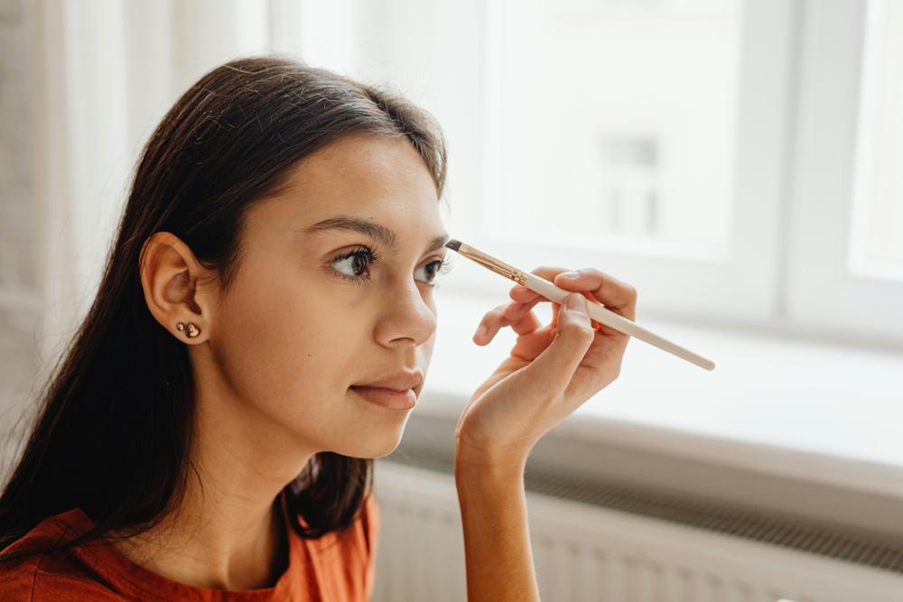 applying eyeshadow